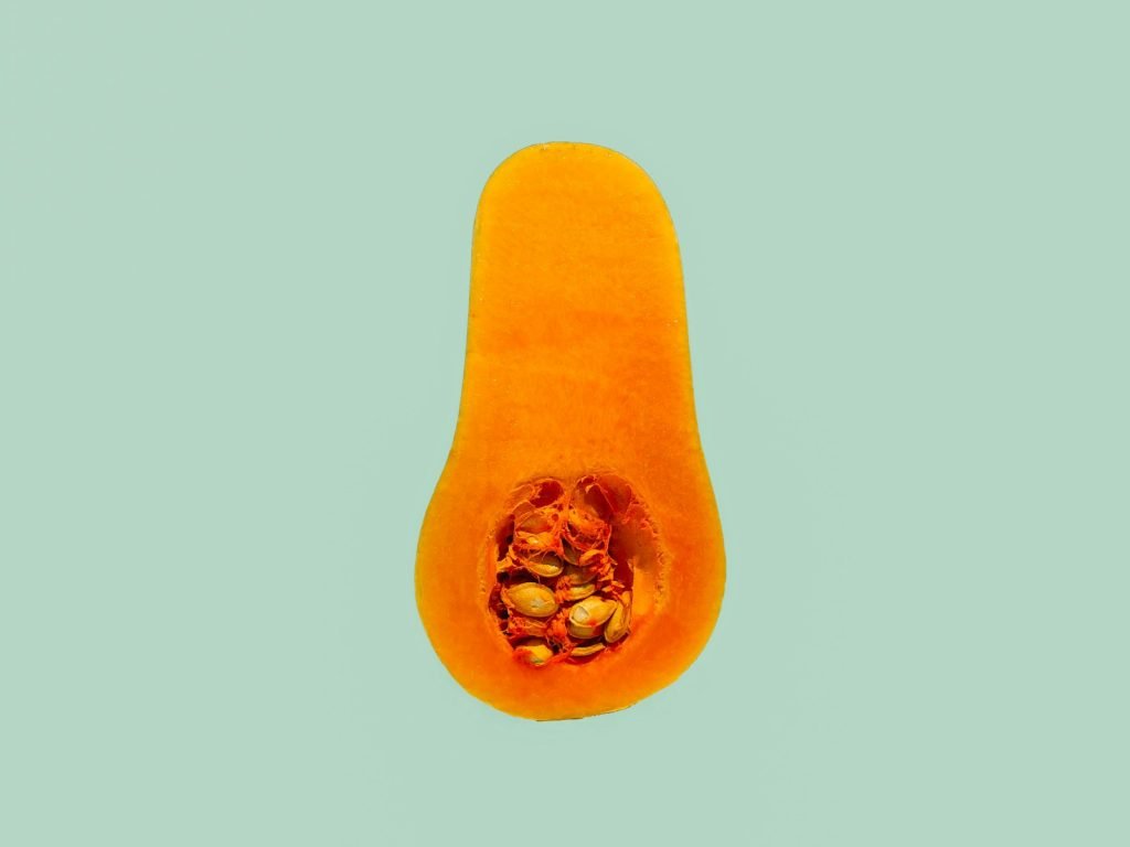 A slice of orange squash on a board